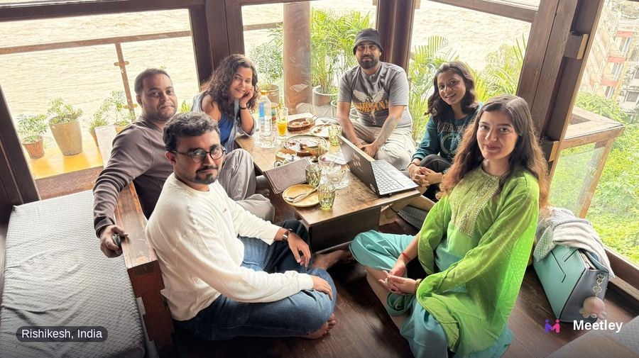 Meetley community meetup around a table in Rishikesh